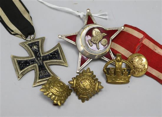 An Iron Cross, Turkish medal and brass pips